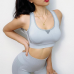 Безшовний комплект спортивний легінси і топ пуш ап світло сірий